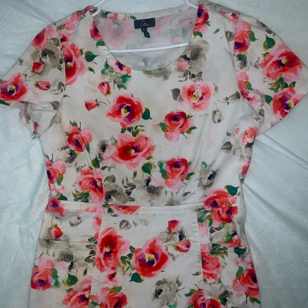 Jaanuu peplum scrub top floral print